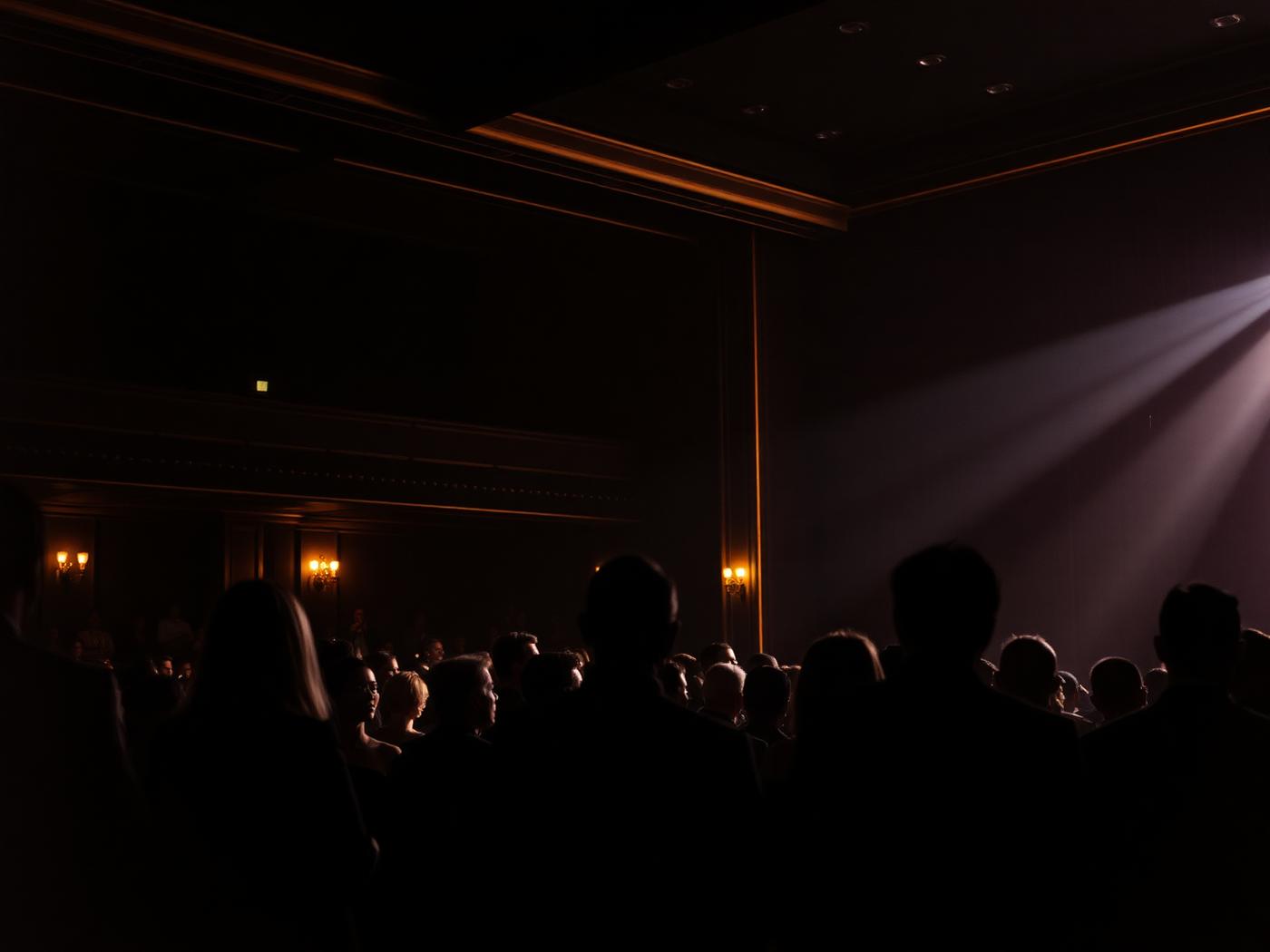 Premiere audience in a dark auditorium